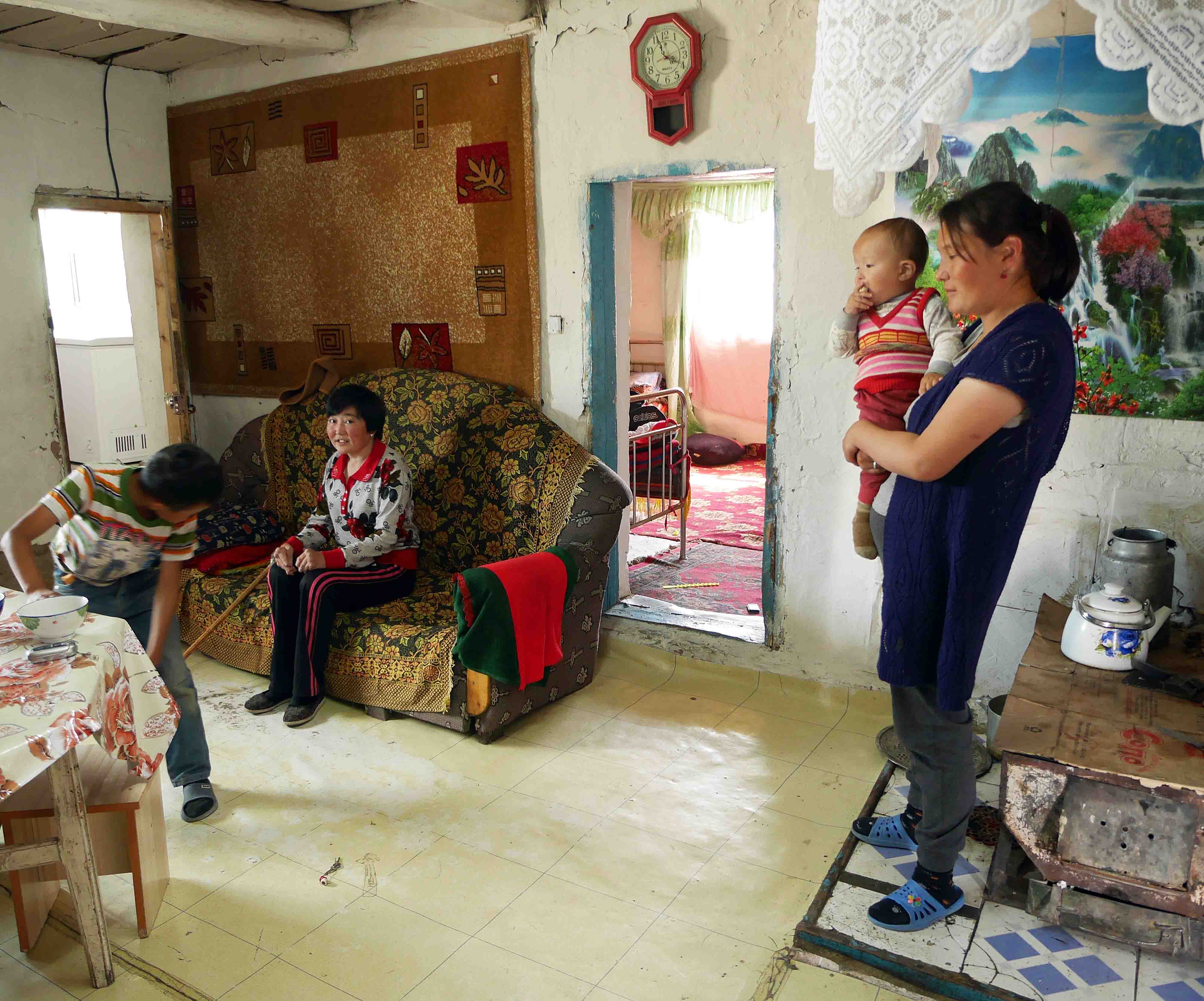 Lena, Oralbek, and a friendly neighbour and child.