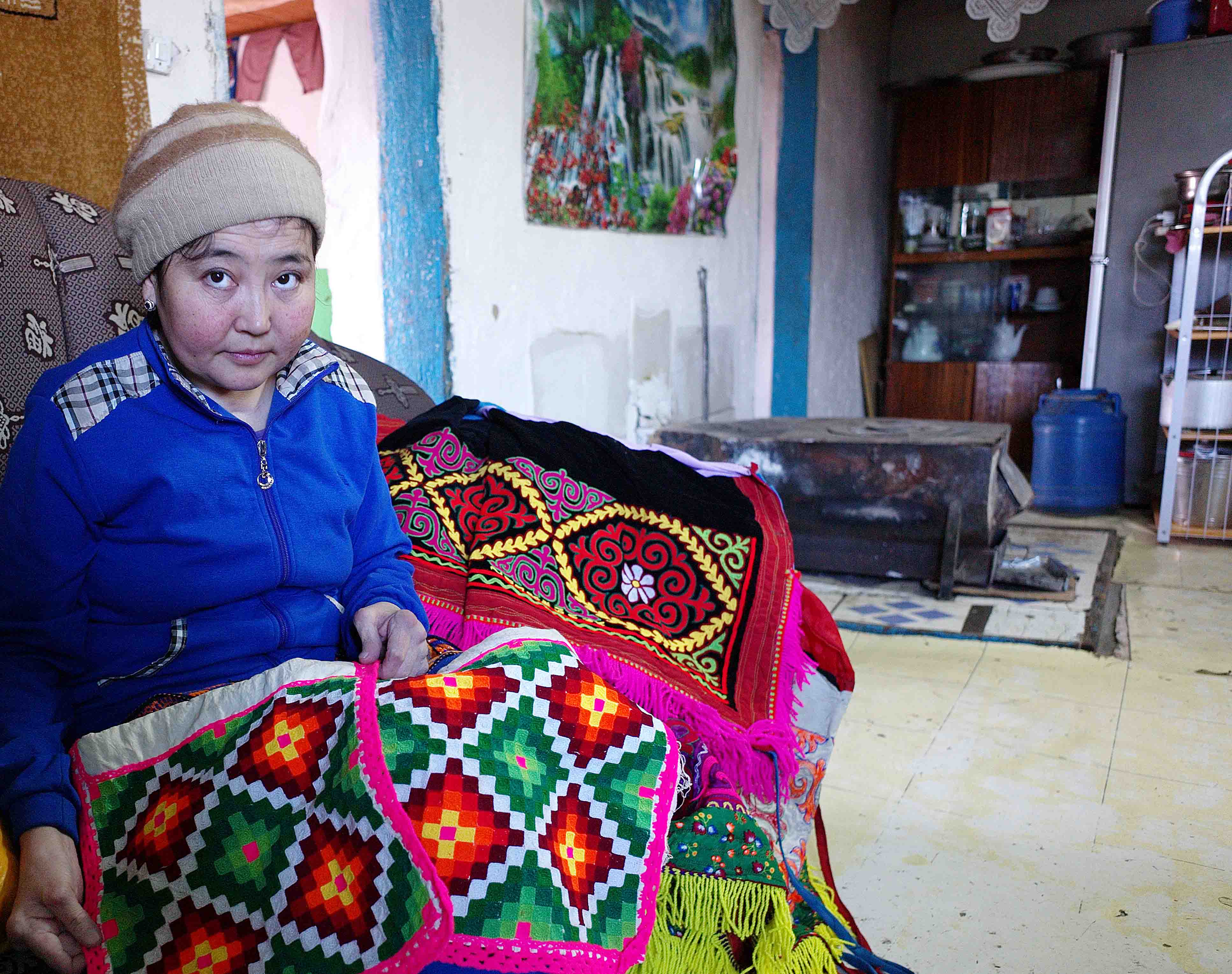 Lena showing her traditional Kazakh needlework skills. She is unable to undertake such work now due to her rheumatoid arthritis.