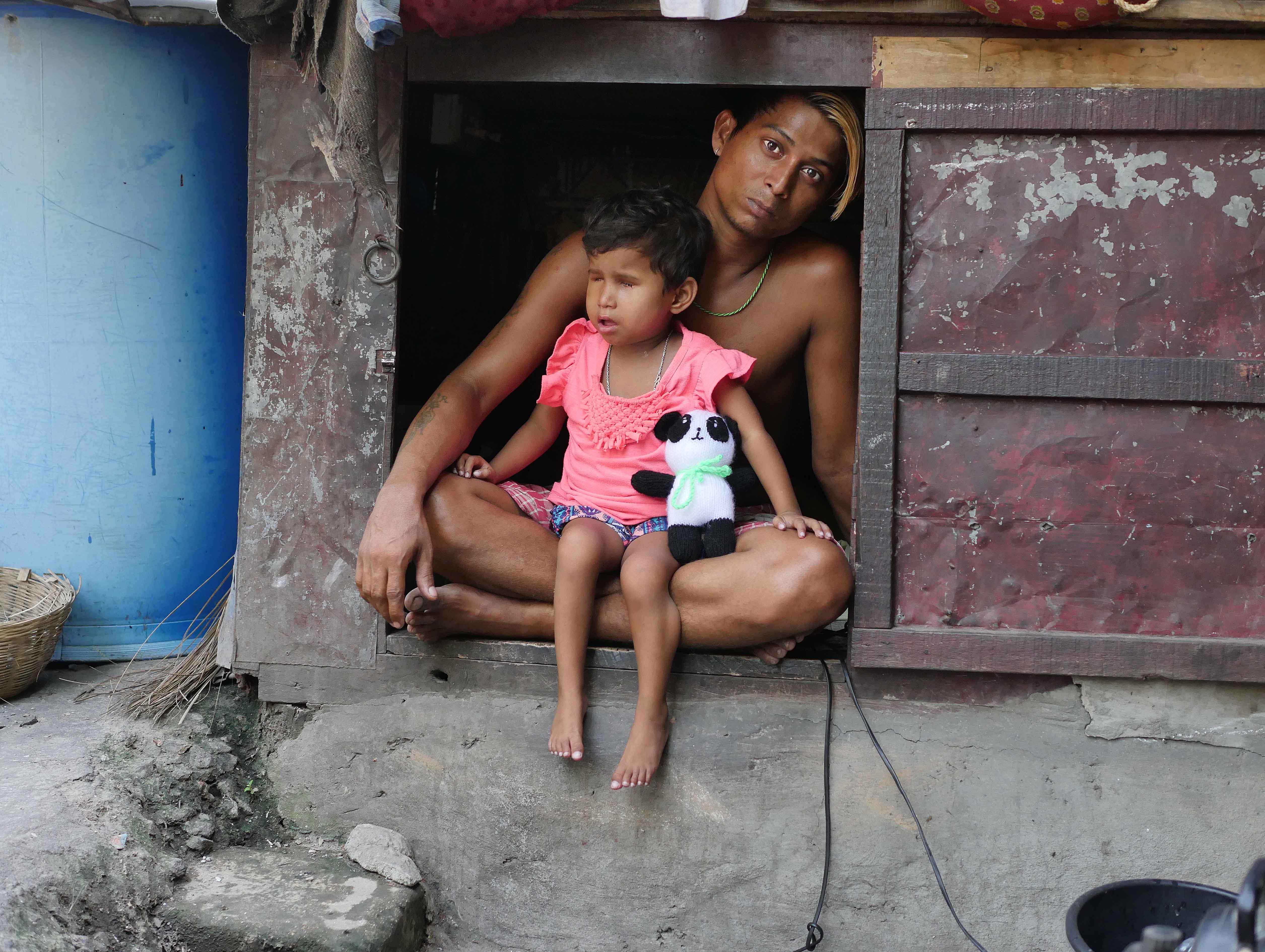  Jyoti and her Dad outside her home