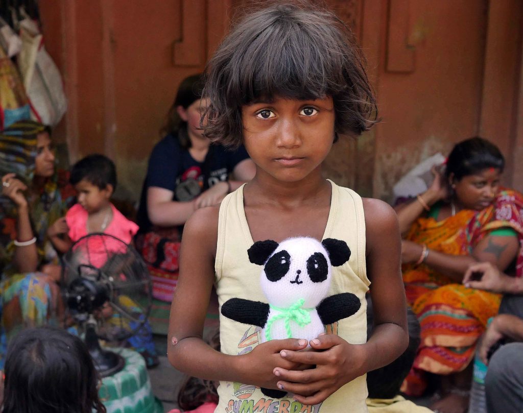 The family and local children were given knitted animals and toys donated by Ilkley people in the UK