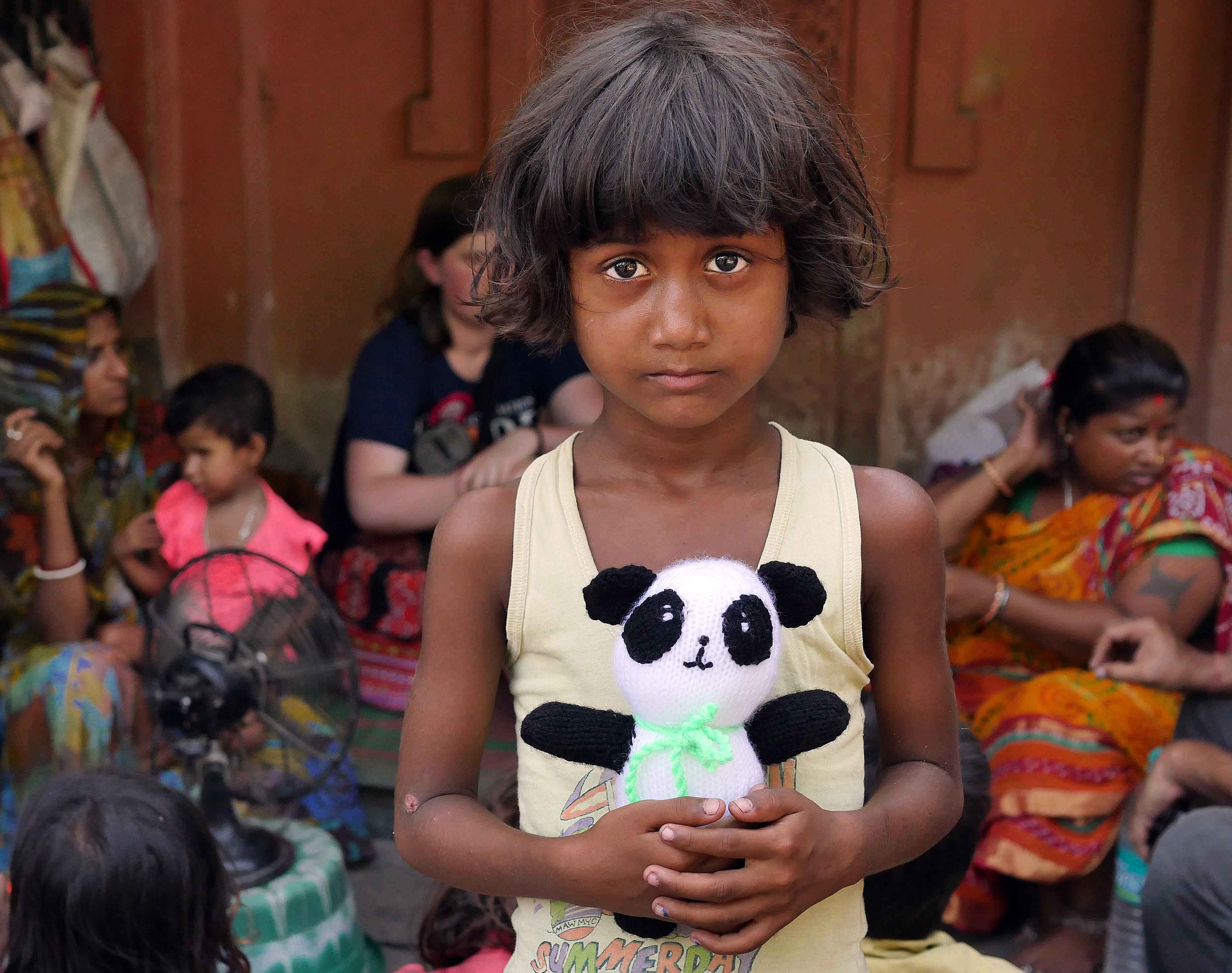 The family and local children were given knitted animals and toys donated by Ilkley people in the UK