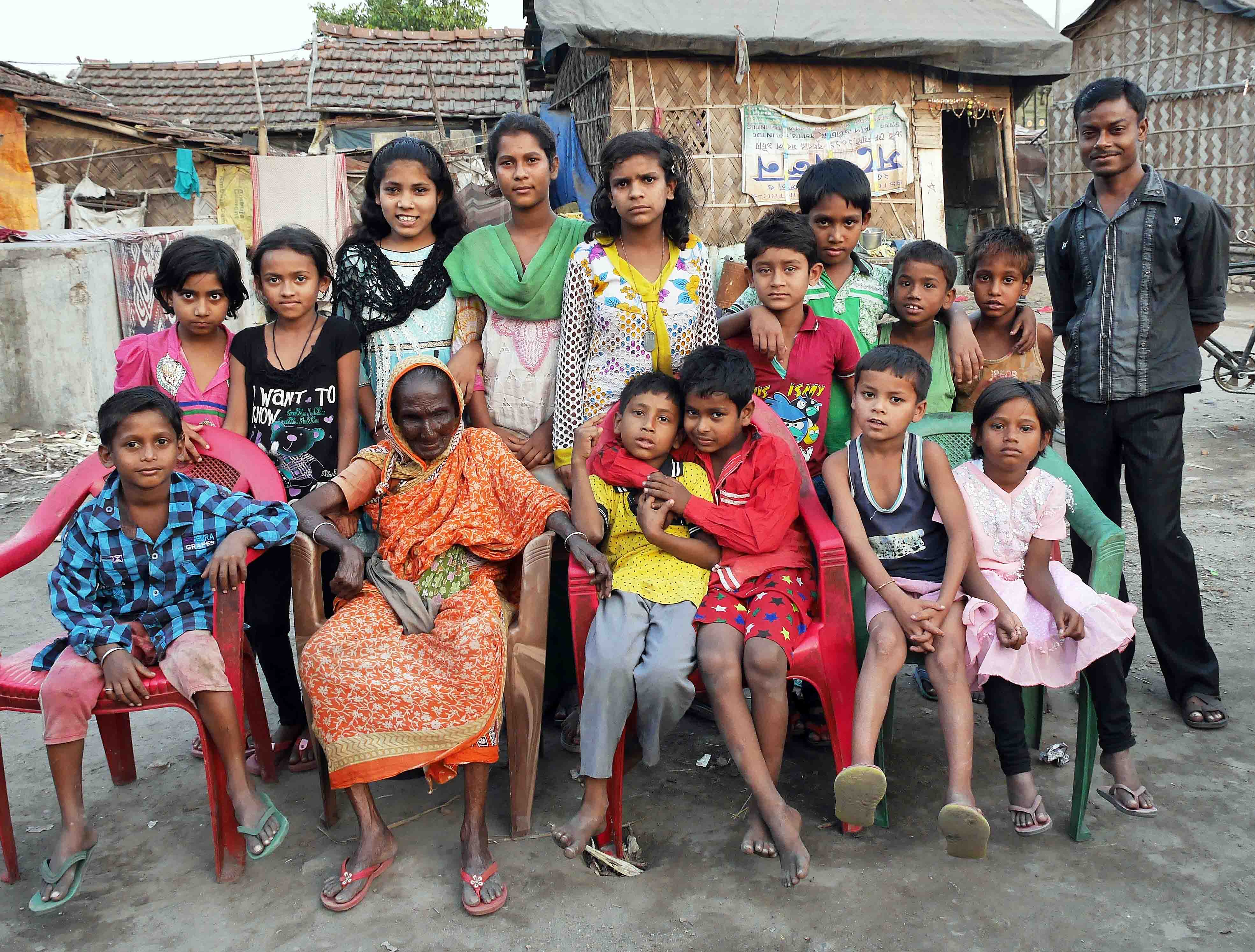 Sabu Jan Bibi with a miscellaneous group of inquisitive children.