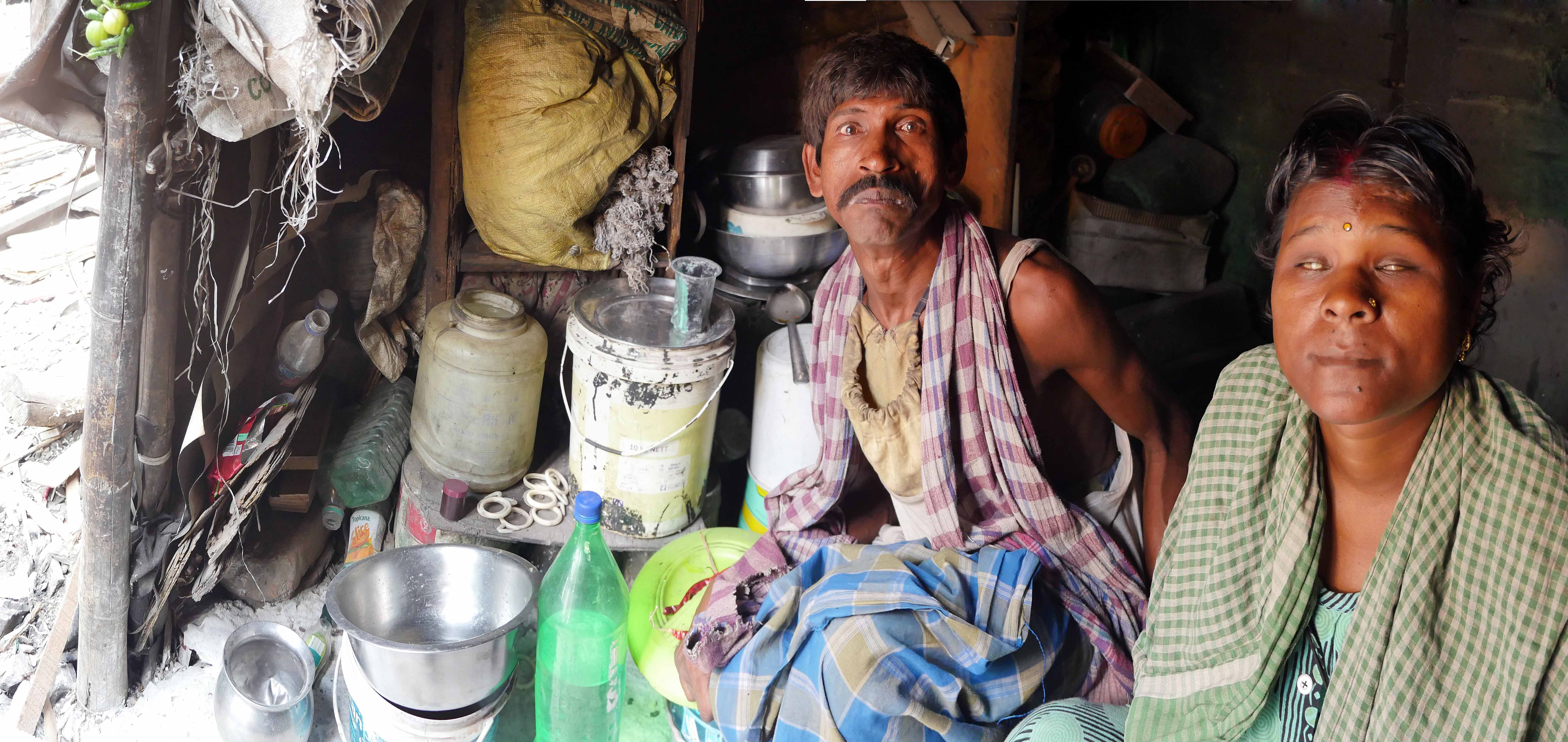 Anita and Bijay in their resurrected home next to the railway line.