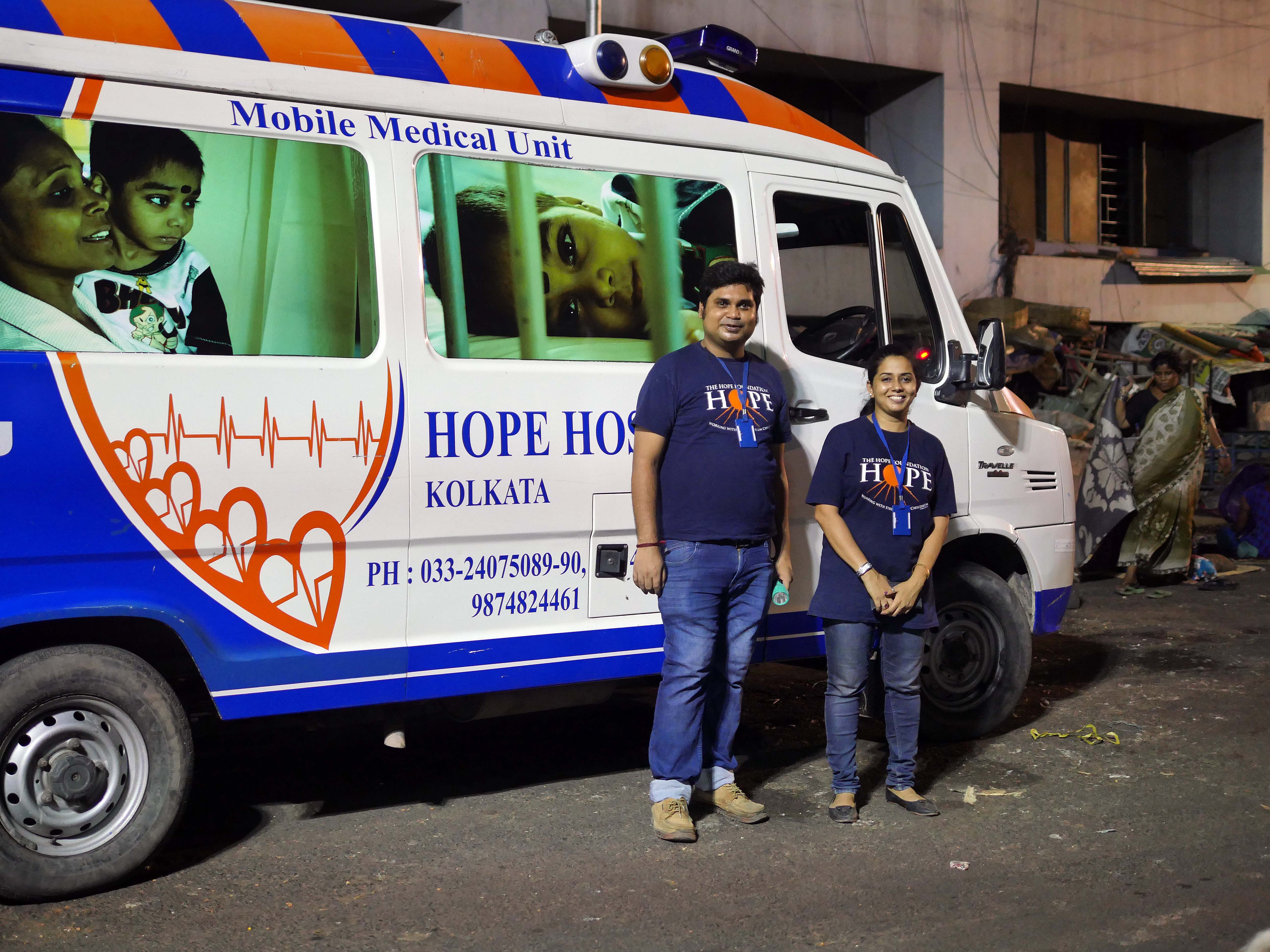 A welfare worker and nurse with the ambulance