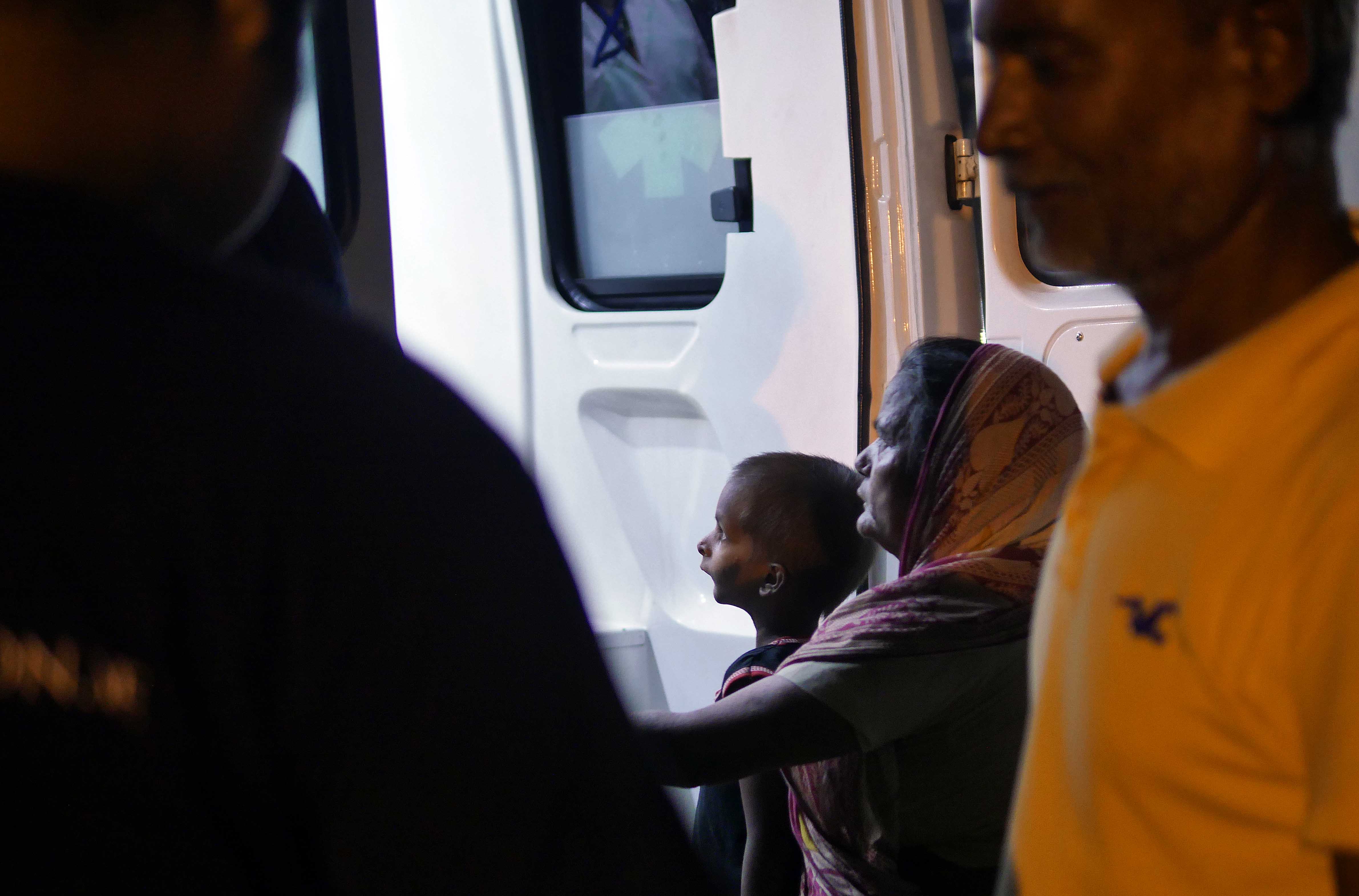 Sheik at the back of the ambulance.